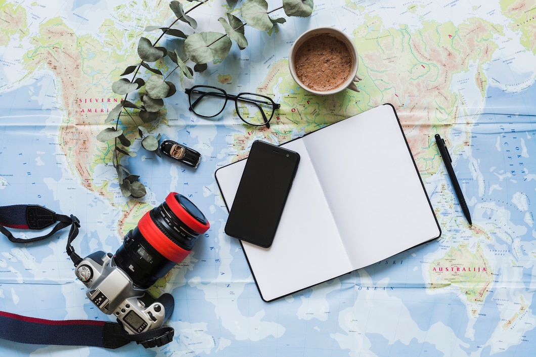 blank-diary-personal-accessories-coffee-cup-world-map_23-2147856128
