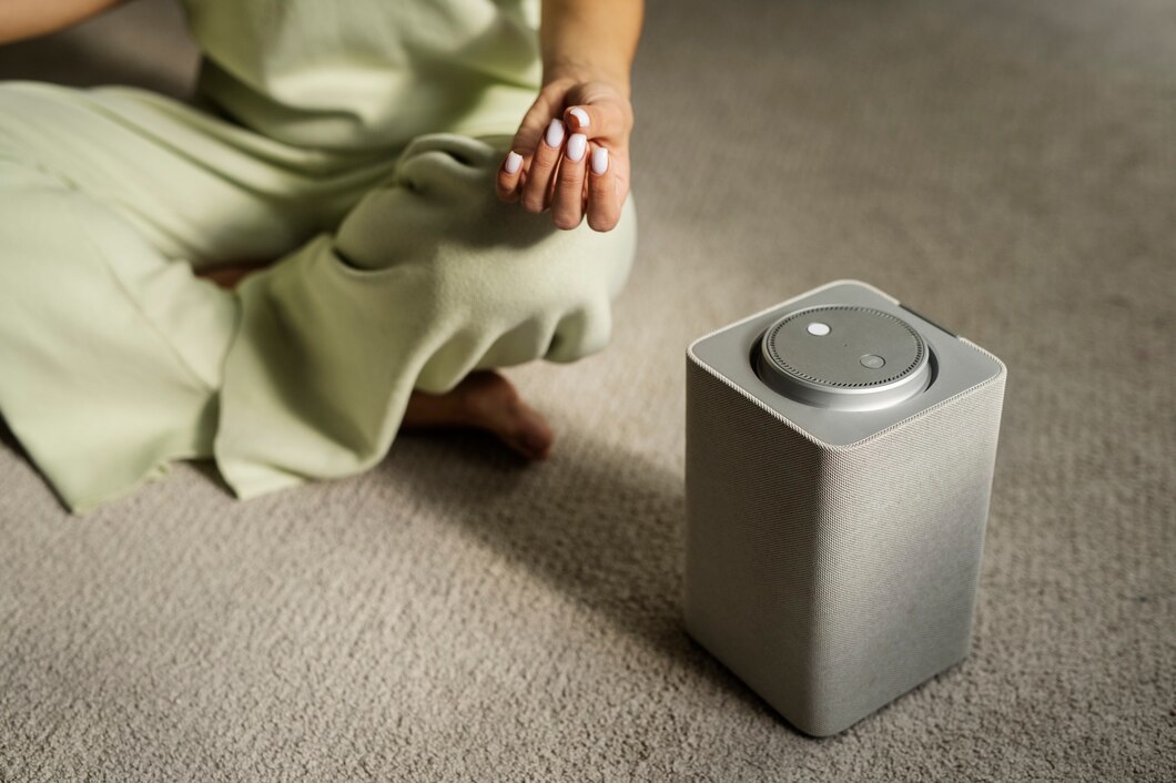 woman-meditating-with-smart-speaker-high-angle_23-2149936253